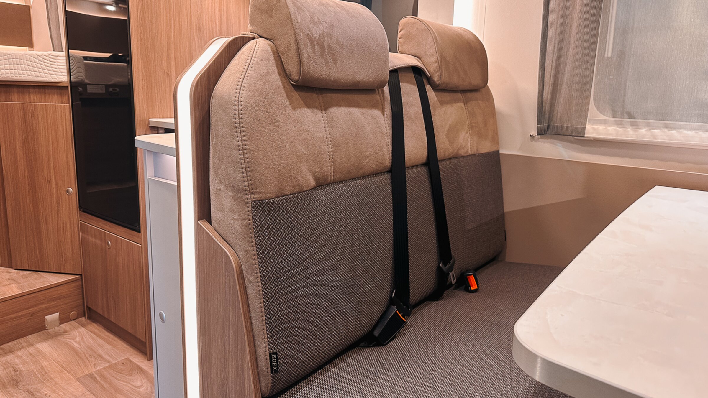 Carado motorhome bench seat with two headrests, seat belts and a dinette table