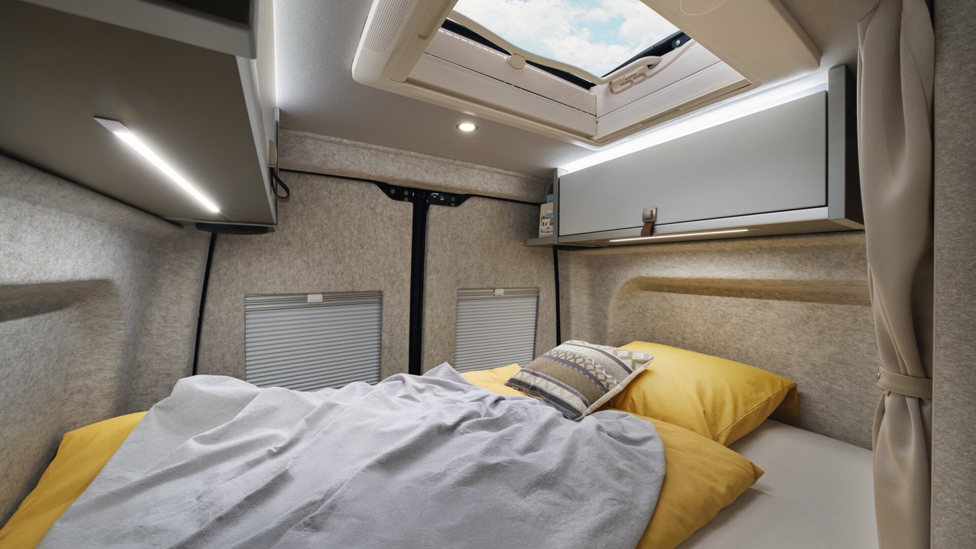The skylight above the rear bed offers an unobstructed view of the starry night sky.